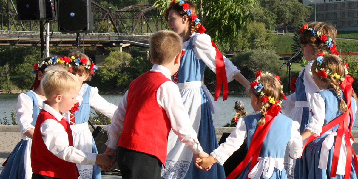 kids in costumes dancing in a circle